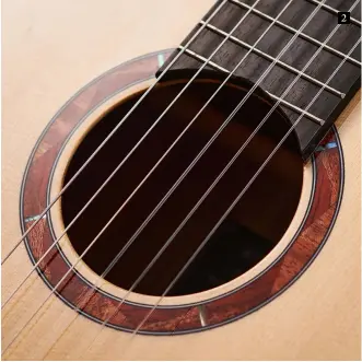  ??  ?? 2 2. The 12-fret NCX style uses a convention­al round soundhole with its very woody decoration. It’s designed for the stage so Yamaha also includes a rubber soundhole plug to alleviate feedback