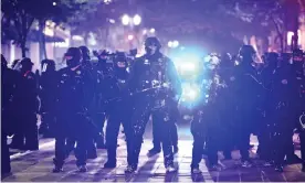  ?? Photograph: Sean Meagher/AP ?? Police in downtown Portland on Wednesday.