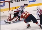  ?? LYNNE SLADKY — THE ASSOCIATED PRESS ?? The Panthers' Carter Verhaeghe slips a shot past Capitals goaltender Ilya Samsonov during the third period of Game 5 on Wednesday. Florida rallied for a 5-3 win.