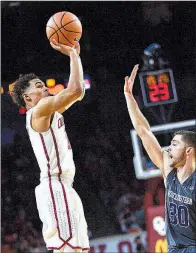  ?? AP/TYLER DRABEK ?? Oklahoma guard Trae Young scored 31 points and had 12 assists in the No. 17 Sooners’ 104-78 victory over Northweste­rn on Friday night in Norman, Okla.