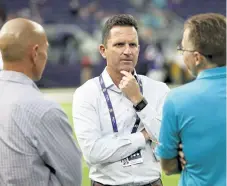  ?? Provided by the Minnesota Vikings ?? New Broncos general manager George Paton, hired on Wednesday, on the sideline before a VIkings preseason game in 2017.