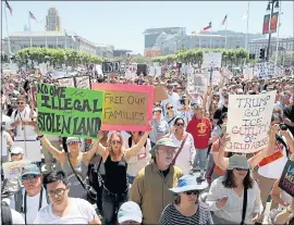  ?? ANDA CHU — STAFF PHOTOGRAPH­ER ?? Above left: Thousands of protesters fill Civic Center Plaza for the Families Belong Together rally in San Francisco Saturday. Above right: People gather during a march at Todos Santos Plaza in Concord Saturday.
