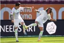  ??  ?? Daniel Ginczek (left) celebrates his injury-time winner with Kevin Mbabu. Photograph: Tobias Hase/AFP via Getty Images