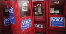  ?? MARK LENNIHAN — THE ASSOCIATED PRESS ?? Plastic newspaper boxes for The Village Voice stand along a Manhattan sidewalk in New York.