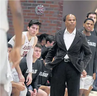  ?? JIM MICHAUD / BOSTON HERALD ?? NOT GOOD ENOUGH: Coach Tommy Amaker looks on during Harvard’s 81-71 loss to Northeaste­rn on Friday night at Lavietes Pavillion.