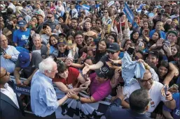  ?? ALLEN J. SCHABEN/LOS ANGELES TIMES ?? Democratic presidenti­al candidate Sen. Bernie Sanders greets supporters after speaking at Valley High School in Santa Ana on Friday.