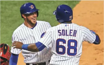  ?? DENNIS WIERZBICKI, USA TODAY SPORTS ?? Cubs teammates Kris Bryant and Jorge Soler celebrate Monday during their team’s win.