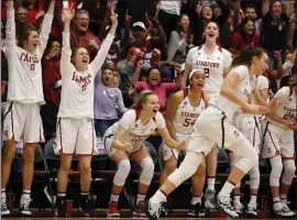  ?? STAFF FILE PHOTO ?? The Stanford Cardinal bench celebrates a 3-point basket against BYU in their NCAA Division I second round basketball game at Maples Pavilion in Stanford in March.