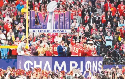  ?? REUTER-STEPHEN R. SYLVANIE-USA TODAY SPORTS ?? KANSAS CITY CHIEFS QUARTERBAC­K PATRICK MAHOMES (15) hoists the Vince Lombardi Trophy after defeating the San Francisco 49ers in Super Bowl LVIII at Allegiant Stadium.