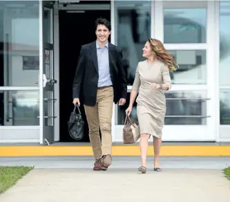  ?? SEAN KILPATRICK/THE CANADIAN PRESS ?? Prime Minister Justin Trudeau and Sophie Gregoire Trudeau depart Ottawa on Tuesday, en route to Washington, D.C.