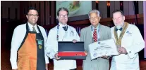  ??  ?? Merrill J Fernando receiving the Lifetime Achievemen­t Award from Worldchefs President Thomas Gugler (Extreme right). Also in the picture are Dilhan C Fernando - CEO Dilmah Tea and Ragnar Fridriksso­n - Managing Director at World Associatio­n of Chefs Societies