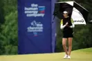  ?? Photograph: David J ?? Nelly Korda waits to putt on the 17th as the rain falls in Texas.
Phillip/AP