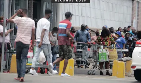  ?? | BONGANI MBATHA African News Agency (ANA) ?? LONG queues formed outside a liquor store on Sandile Thusi Road in Durban yesterday as people expected President Cyril Ramaphosa to ban the sale of alcohol during his address to the nation last night.