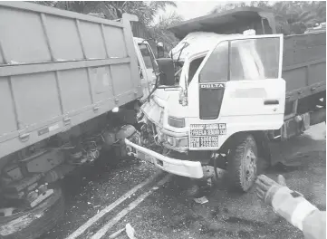  ??  ?? The two lorries involved in the head-on collision.