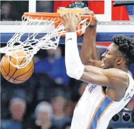  ?? [PHOTO BY NATE BILLINGS, THE OKLAHOMAN] ?? Oklahoma City’s Jerami Grant dunks during Monday’s game with the Utah Jazz.