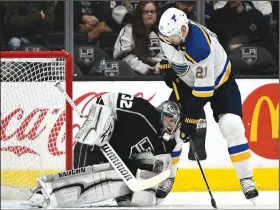  ?? AP/JOHN McCOY ?? Blues center Patrik Berglund (21) tries to push the puck past Kings goaltender Jonathan Quick on Saturday in Los Angeles.