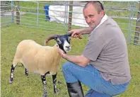  ??  ?? Angus Cameron won champion of the blackfaces­heep and reserve with his shearland tup