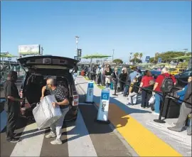  ?? Mel Melcon Los Angeles Times ?? LAX expanded its ride-hailing pickup zone Wednesday, drawing praise from travelers. But the expansion had a victim: the Park ’N Fly lot whose land was taken.