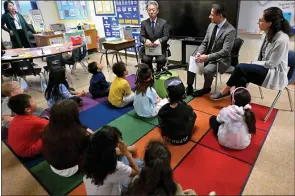  ?? BRITTANY MURRAY STAFF PHOTOGRAPH­ER ?? Second graders at Amestoy Elementary School were treated to a visit by Consulate General of Japan Sone Kenko, center left, LAUSD Superinten­dent Alberto M. Carvalho, middle, and LAUSD board member Tanya Ortiz Franklin in celebratio­n of Read Across America week in Gardena on Monday.