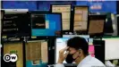  ??  ?? A trader watches monitors at a foreign exchange dealing room in Seoul, South Korea