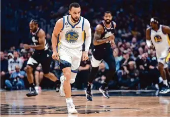  ?? Jae C. Hong/Associated Press ?? Warriors star Stephen Curry is questionab­le to face the Hawks on Friday because of left thumb soreness and could leave Golden State in a bind with Draymond Green already set to miss the game.