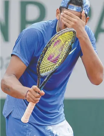  ?? OH, NO: Australia's Nick Kyrgios gestures after missing a shot against South Africa's Kevin Anderson during their second round match of the French Open. Picture: AAP ??