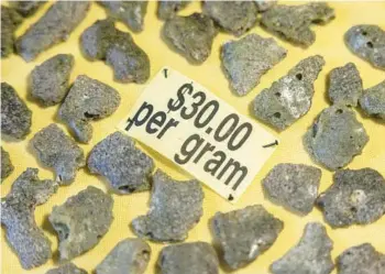  ?? ?? Trinitite, for sale at a rock shop in Bingham, N.M., formed when sand, liquefied by the 1945 atomic blast, fell back to Earth.