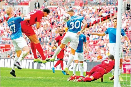  ?? ADRIAN DENNIS/AFP ?? Liverpool’s German-born Cameroonia­n defender Joel Matip heads home to make the score 1-1 in the English FA Community Shield football match between Manchester City and Liverpool at Wembley Stadium in north London on Sunday.