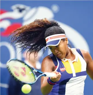 ??  ?? Japan’s Naomi Osaka returns the ball to Germany’s Angelique Kerber during their 2017 US Open match at the USTA Billie Jean King National Tennis Center in New York on Tuesday. (AFP)