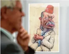  ?? Foto: Monika Skolimowsk­a, dpa ?? Die andere Sicht: Diese Zeichnung zeigt einen beleidigte­n Erdogan mit rotem Eimer auf dem Kopf, der wie ein orientalis­cher Fes wirkt. Illustrato­r Frank Hoppmann hat dafür gerade den Deutschen Karikature­npreis gewonnen.