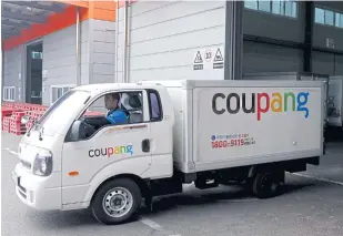  ??  ?? A delivery truck for e-commerce retailer Coupang leaves a distributi­on centre in Seoul. The Commerce Ministry and Coupang executives have agreed to expand cooperatio­n to sell more Thai products.