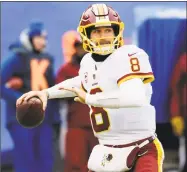  ?? Bill Kostroun / Associated Press ?? Quarterbac­k Kirk Cousins is a free agent after the Redskins didn’t place the franchise tag on him.