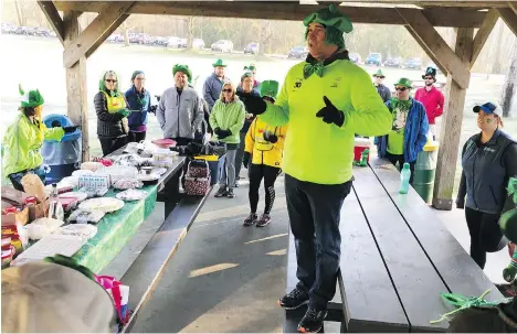  ?? GORD KURENOFF ?? Dennis Nicolato, a Sun Run InTraining Clinic leader in Aldergrove, says his annual St. Patrick’s Day-themed workout at Aldergrove Regional Park brings his crew closer together and is one of the highlights of the 13-week training program.