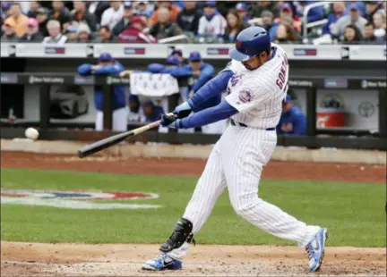  ?? FRANK FRANKLIN II — THE ASSOCIATED PRESS ?? Mets’ Adrian Gonzalez its RBI double during the fifth inning of New York’s victory over Cardinals on Thursday at Citi Field.