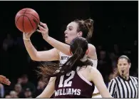  ?? AP/YOUNG KWAK ?? Notre Dame guard Marina Mabrey passes the ball while being defended by Texas A&M guard Danni Williams during the second half Saturday in a women’s NCAA Tournament regional semifinal in Spokane, Wash. Notre Dame won 90-84 to advance to the regional...