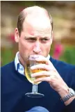  ??  ?? Britain’s Prince William, Duke of Cambridge, takes a sip of an Aspalls cider at The Rose and Crown pub in Snettisham in eastern England.