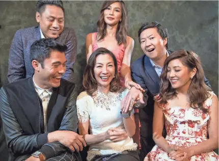  ?? ROBERT HANASHIRO/USA TODAY ?? Director Jon M. Chu, top left, and stars Henry Golding, Gemma Chan, Michelle Yeoh, Ken Jeong and Constance Wu bring “Crazy Rich Asians,” adapted from the 2013 hit novel, to theaters Wednesday.