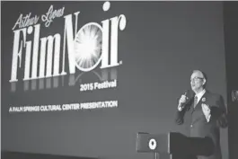  ?? TDS ?? Alan Rode the host and producer of the Arthur Lyons Film Noir Festival speaks during the festival's opening night on Thursday at the Camelot Theatres in Palm Springs.