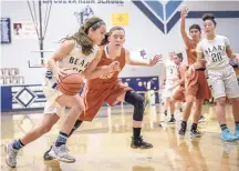  ?? ROBERTO E. ROSALES/JOURNAL ?? La Cueva’s Rachael Hathoot, left, drives to the basket while guarded by Eldorado’s Rachel Williams on Saturday.