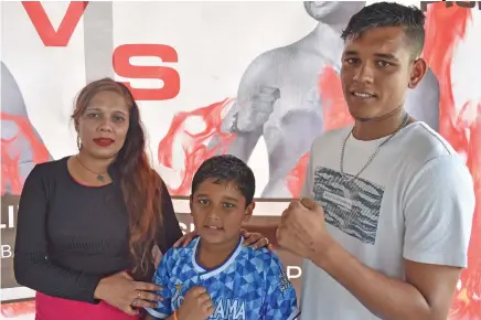  ?? Photo: Waisea Nasokia ?? Nikesh ‘The Blade’ Prasad (right) with mum Farina Raza and younger brother in Martintar, Nadi.