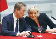  ?? (Charles Platiau/Reuters) ?? NATIONAL FRONT presidenti­al candidate Marine Le Pen and former Debout La France presidenti­al candidate Nicolas Dupont-Aignan hold a joint press conference in Paris yesterday.