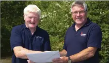  ??  ?? Tony Cullen from Ballygarva­n, Gusserane who retired from John F. Kennedy arboretum after working there for 45.5 years receiving a presentati­on from John Carr on behalf of his co-workers.