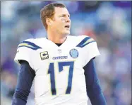  ?? Carolyn Kaster / Associated Press ?? When Los Angeles Chargers quarterbac­k Philip Rivers, age 37, and Tom Brady, age 41, meet in Sunday’s AFC divisional-round game, Rivers (above) will have the age advantage, but Brady will have the cold-weather and experience advantage.