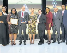  ??  ?? Members of the GraceKenne­dy Limited team pose with their award. From left: Sydoney Johnson, Grace Burnett, Don Wehby, Gail MossSolomo­n, Andrew Messado, Naomi Holness, Andrew Leo-Rhynie and Frank James.