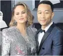  ?? GETTY IMAGES ?? John Legend and Chrissy Teigen support the march that is being organized by Marjory Stoneman Douglas students.