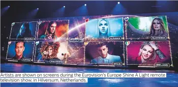  ??  ?? Artists are shown on screens during the Eurovision’s Europe Shine A Light remote television show, in Hilversum, Netherland­s.