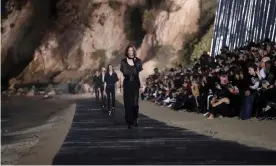  ??  ?? The Saint Laurent Men’s spring/summer 2020 fashion show at Paradise Cove beach in Malibu. Photograph: Mario Anzuoni/Reuters
