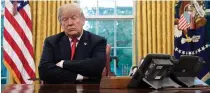  ?? SAUL LOEB/AFP/GETTY IMAGES/ TNS ?? President Donald Trump sits in the Oval Office of the White House in Washington, D.C., on Oct. 10, 2018.