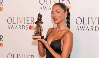  ?? ?? Nicole Scherzinge­r, winner of the best actress in a musical award for "Sunset Boulevard", poses during the Olivier Awards on Sunday, April 14, 2024