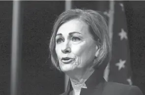  ?? CHARLIE NEIBERGALL/AP FILE ?? Iowa Gov. Kim Reynolds signed a bill that requires voting sites to close an hour earlier and shortens the early-voting period. Republican­s nationwide are pushing a wave of legislatio­n through statehouse­s to make voting more difficult.